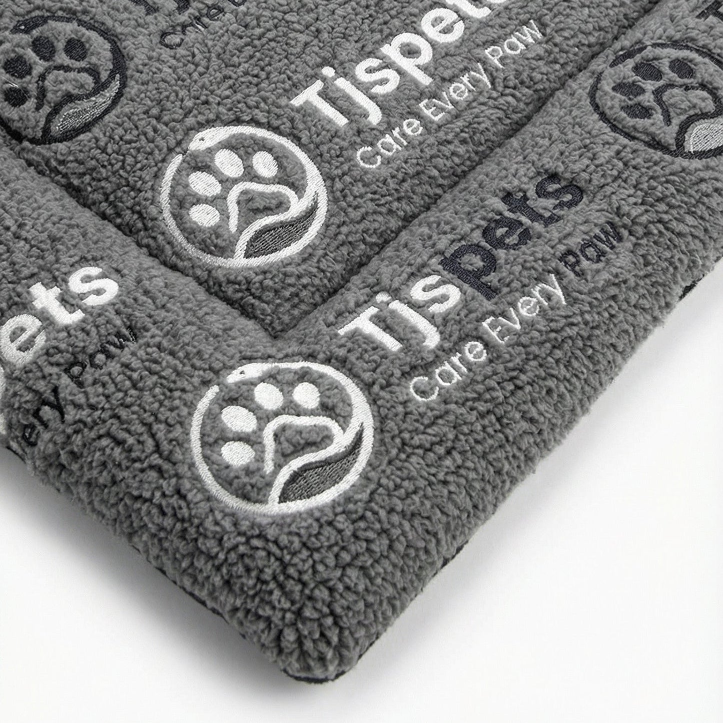 Gray pet towels with TJSpets branding on a white background