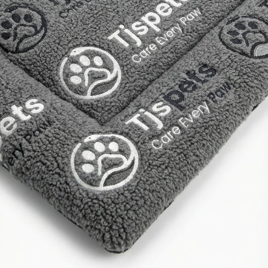 Gray pet towels with TJSpets branding on a white background