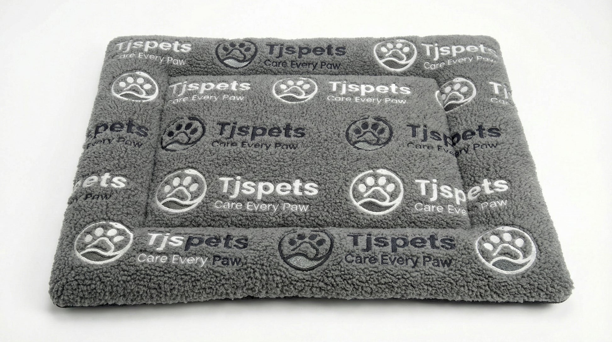 Gray pet blanket with Tjspets branding on a white background