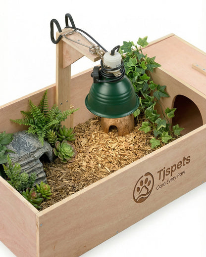 Tispets pet habitat with wooden box, plants, and lamp on a white background